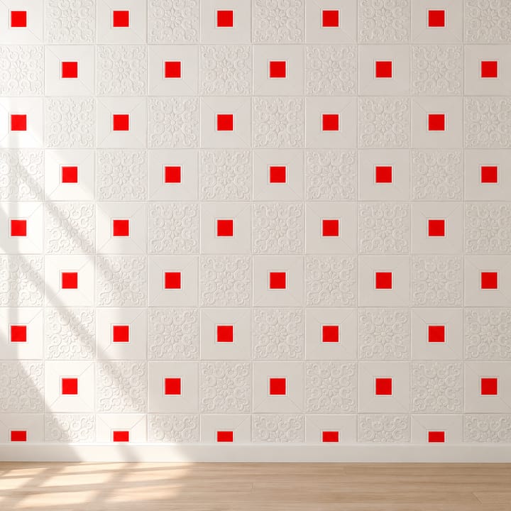 Living room wall covered in white embossed foam tiles with red squares