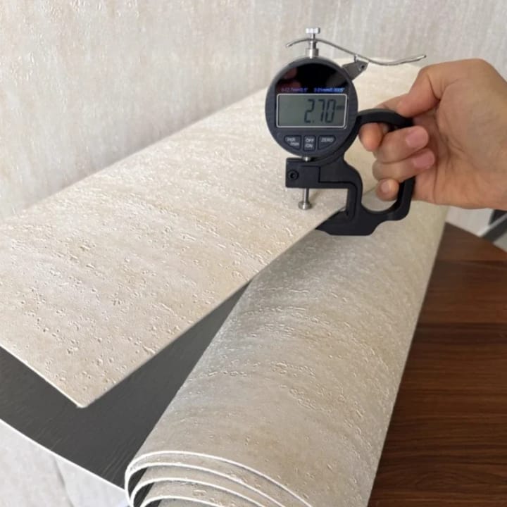 Caliper measuring the thickness of the stone-look sheet