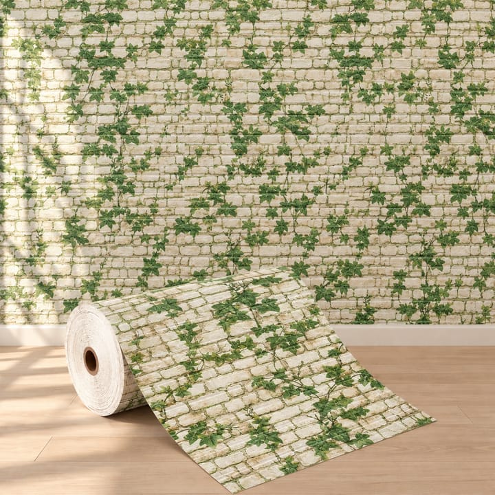 Ivy foam brick roll, cream brick printed with green ivy, below a TV