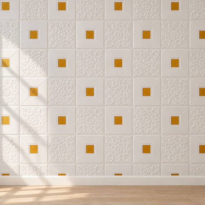 Woman pressing a white embossed foam tile with gold squares onto a wall