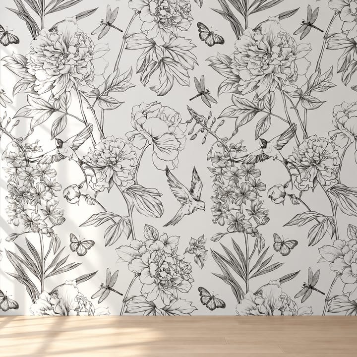 Peony and butterfly sketch wallpaper behind a pale wood dining table