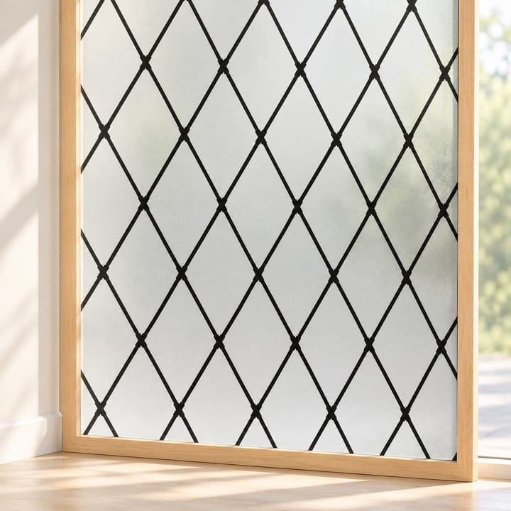 Close view of black lattice frosted window film on glass