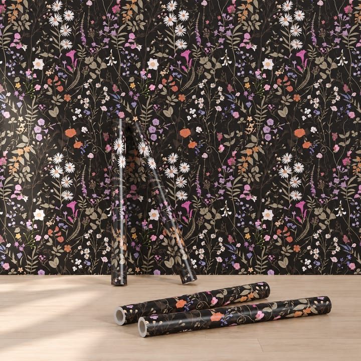 Black meadow wallpaper with bright wildflowers and rolls on the floor
