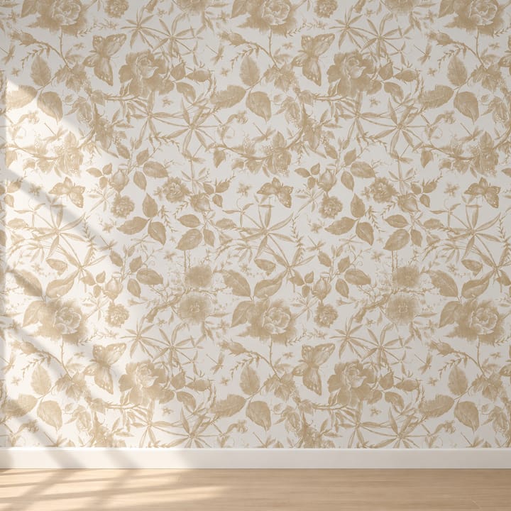 Bedroom wall in champagne rose wallpaper behind an upholstered bed