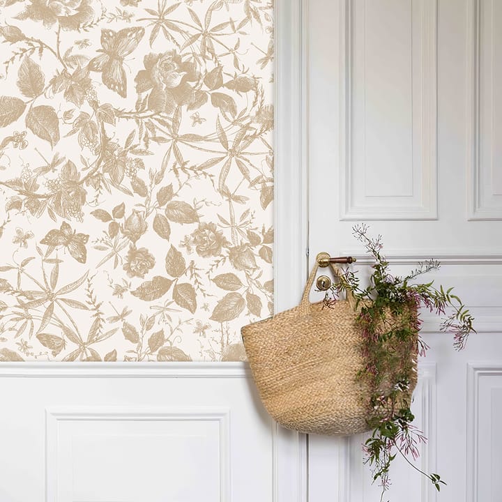 Champagne rose wallpaper beside a white door with a woven basket