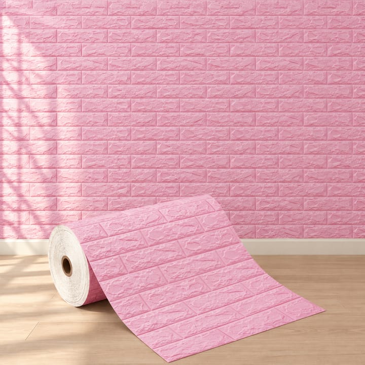 Pink foam brick roll in front of a pink brick bedroom wall