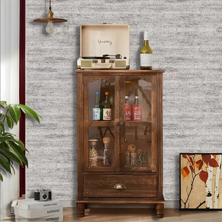 Gray stone-look wall behind a wooden cabinet